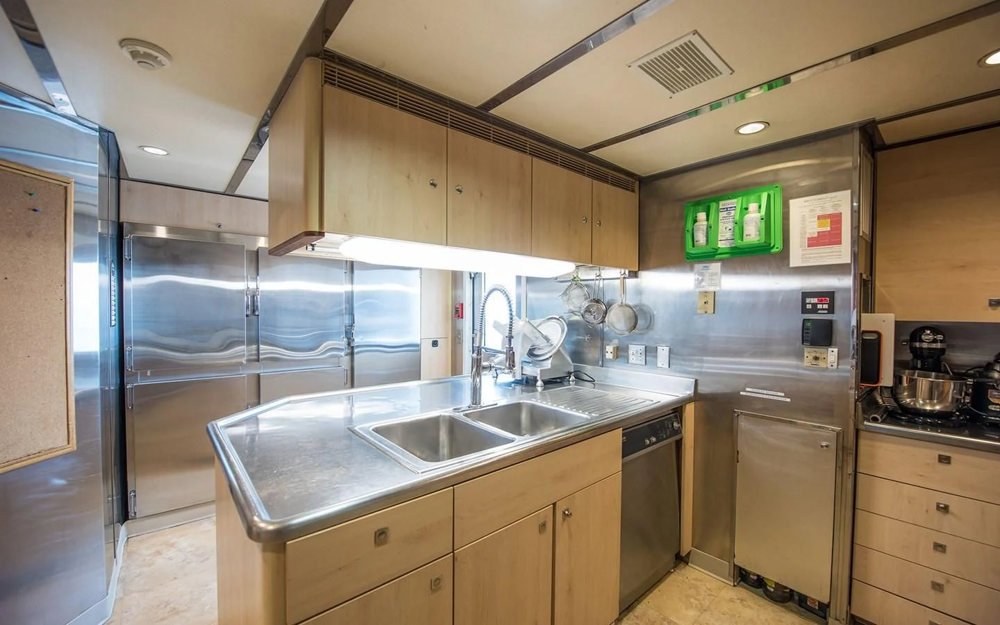 a kitchen with a glass wall aboard BLUE STAR Yacht for Sale