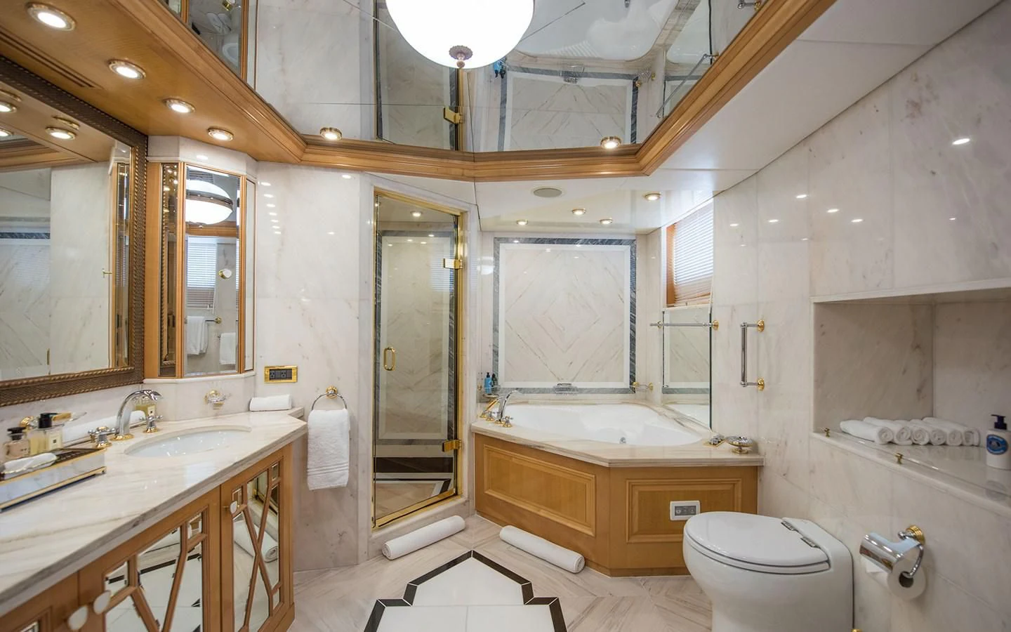 a bathroom with a large mirror aboard BLUE STAR Yacht for Sale