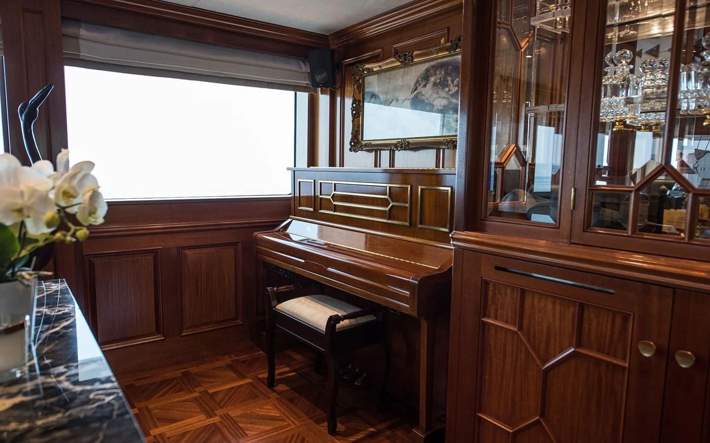 a piano in a room aboard BLUE STAR Yacht for Sale