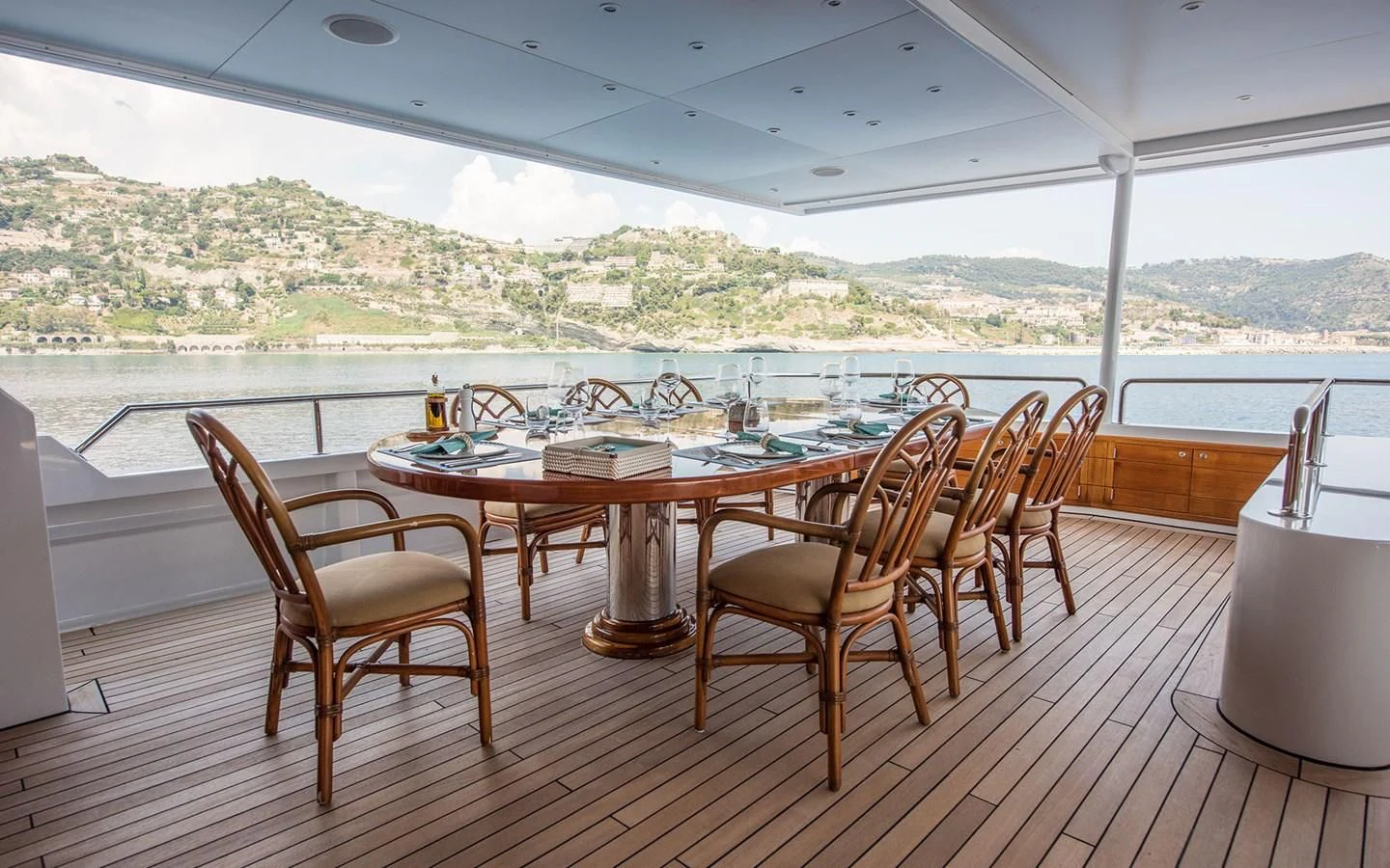 a table and chairs on a deck aboard BLUE STAR Yacht for Sale