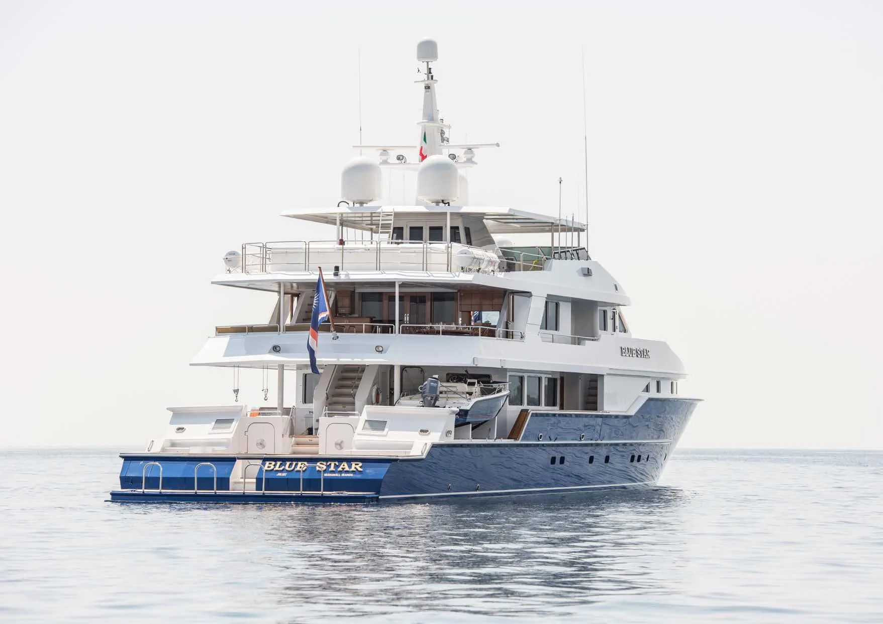 a large white boat in the water aboard BLUE STAR Yacht for Sale