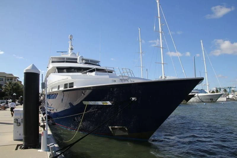 a large boat docked at a pier aboard BLUE STAR Yacht for Sale
