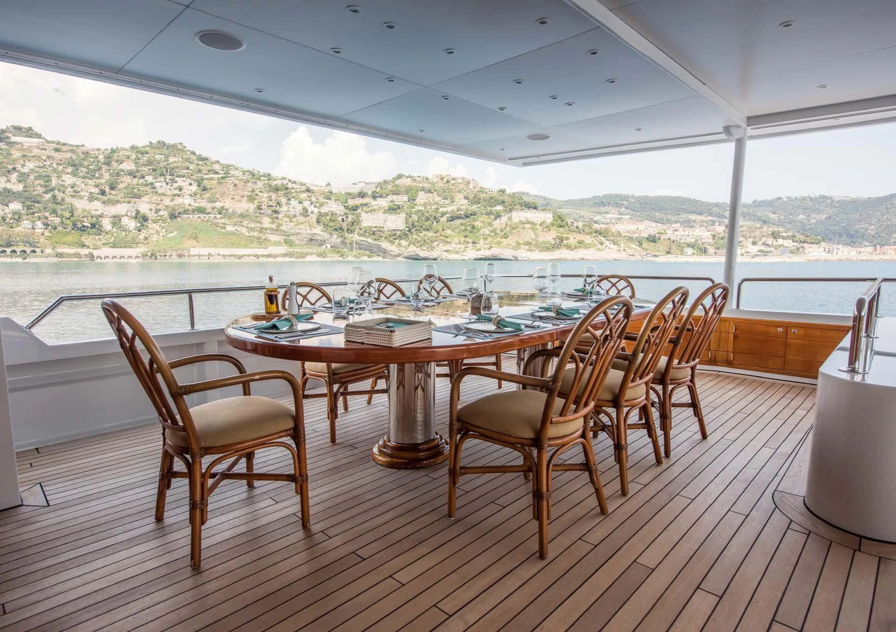 a table and chairs on a deck aboard BLUE STAR Yacht for Sale