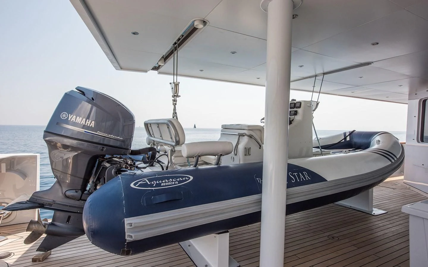 a boat on a deck aboard BLUE STAR Yacht for Sale