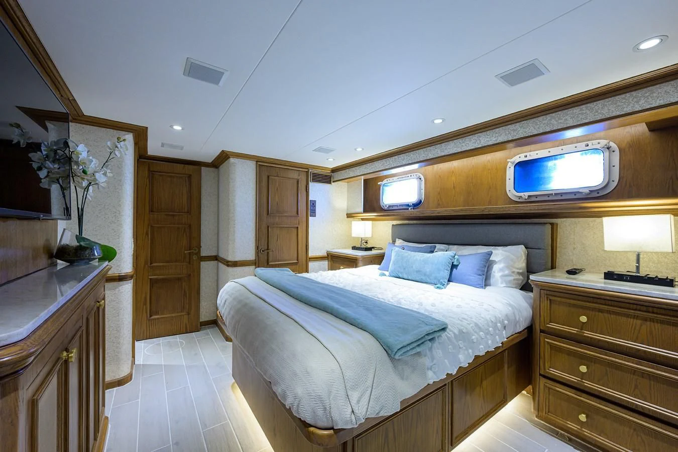 a bedroom with a bed and a desk aboard OCEAN DRIVE Yacht for Sale