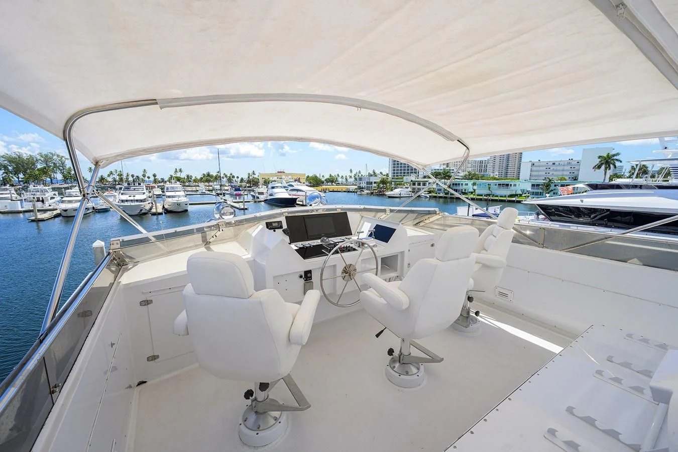 a white boat with chairs on it aboard OCEAN DRIVE Yacht for Sale