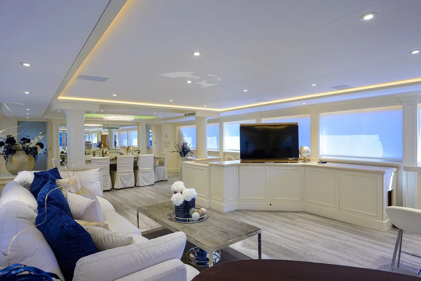 a living room with a large screen aboard OCEAN DRIVE Yacht for Sale
