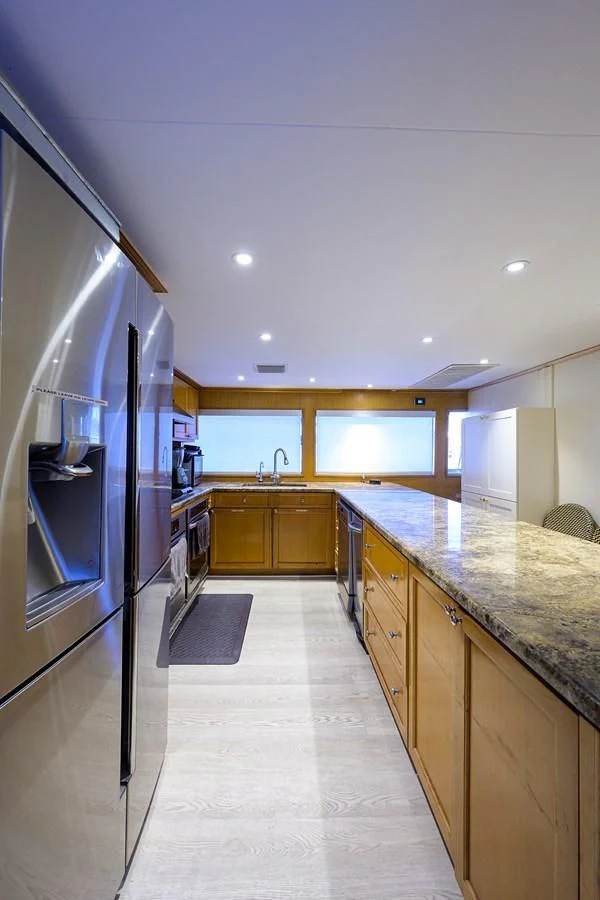 a kitchen with a large island aboard OCEAN DRIVE Yacht for Sale