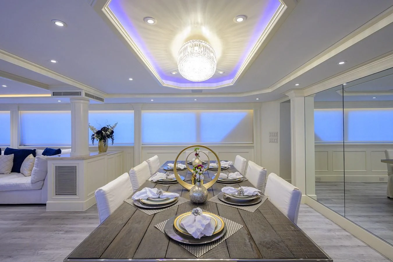 a large room with a table and chairs aboard OCEAN DRIVE Yacht for Sale