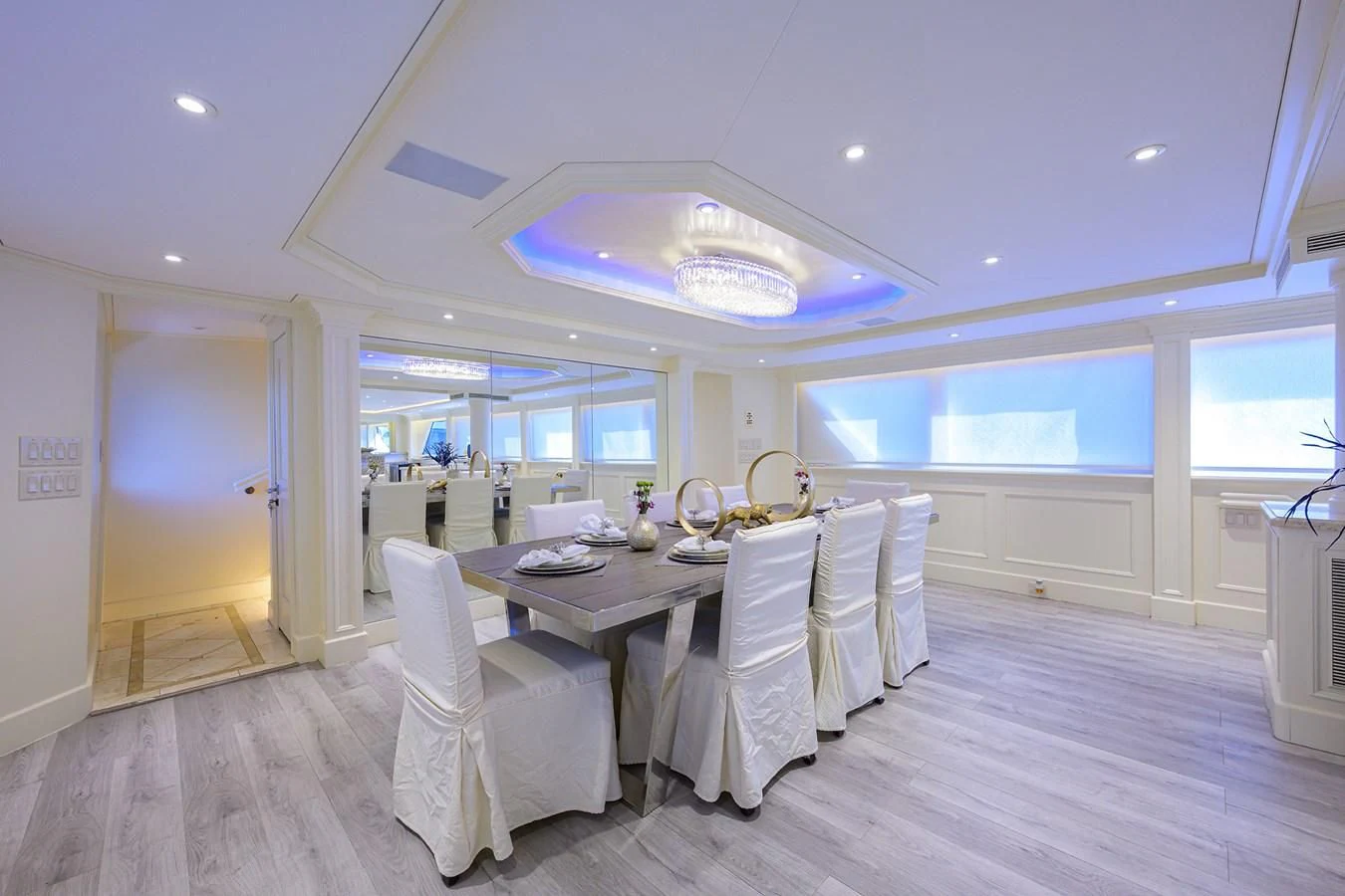 a large white dining room with a large table and chairs aboard OCEAN DRIVE Yacht for Sale