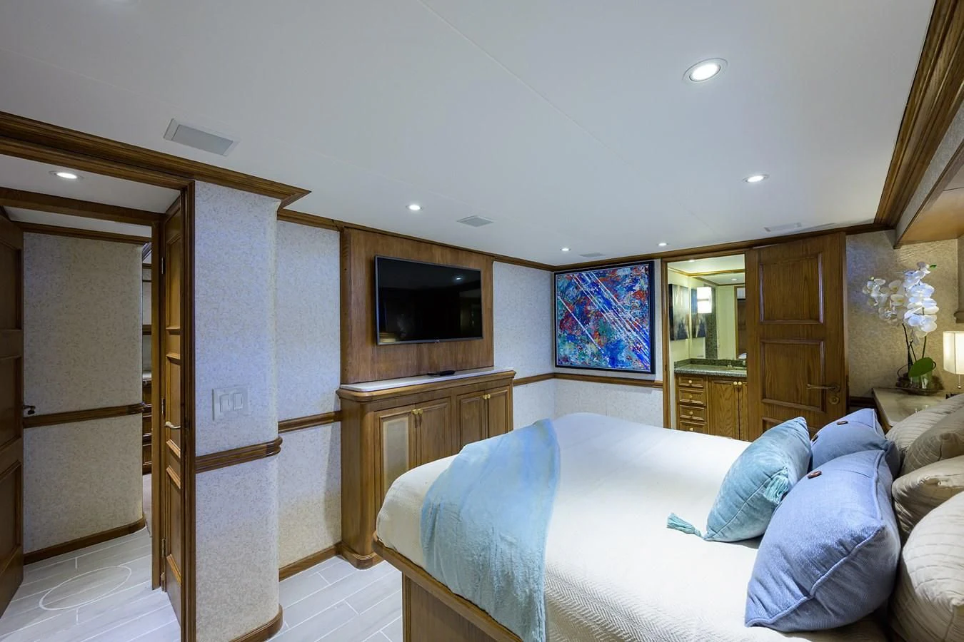 a bedroom with a bed and a television aboard OCEAN DRIVE Yacht for Sale