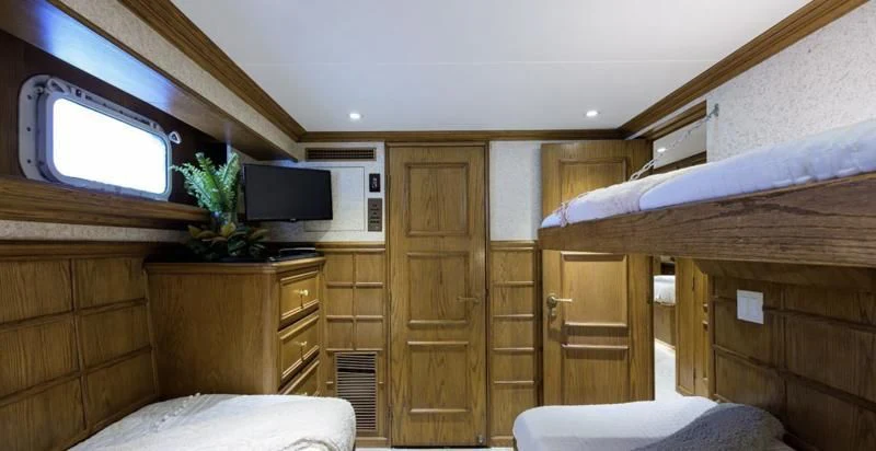 a room with a wood cabinet and a tv aboard OCEAN DRIVE Yacht for Sale