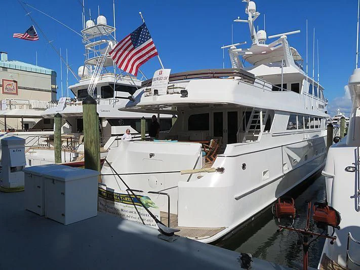 a large white boat with flags aboard OCEAN DRIVE Yacht for Sale
