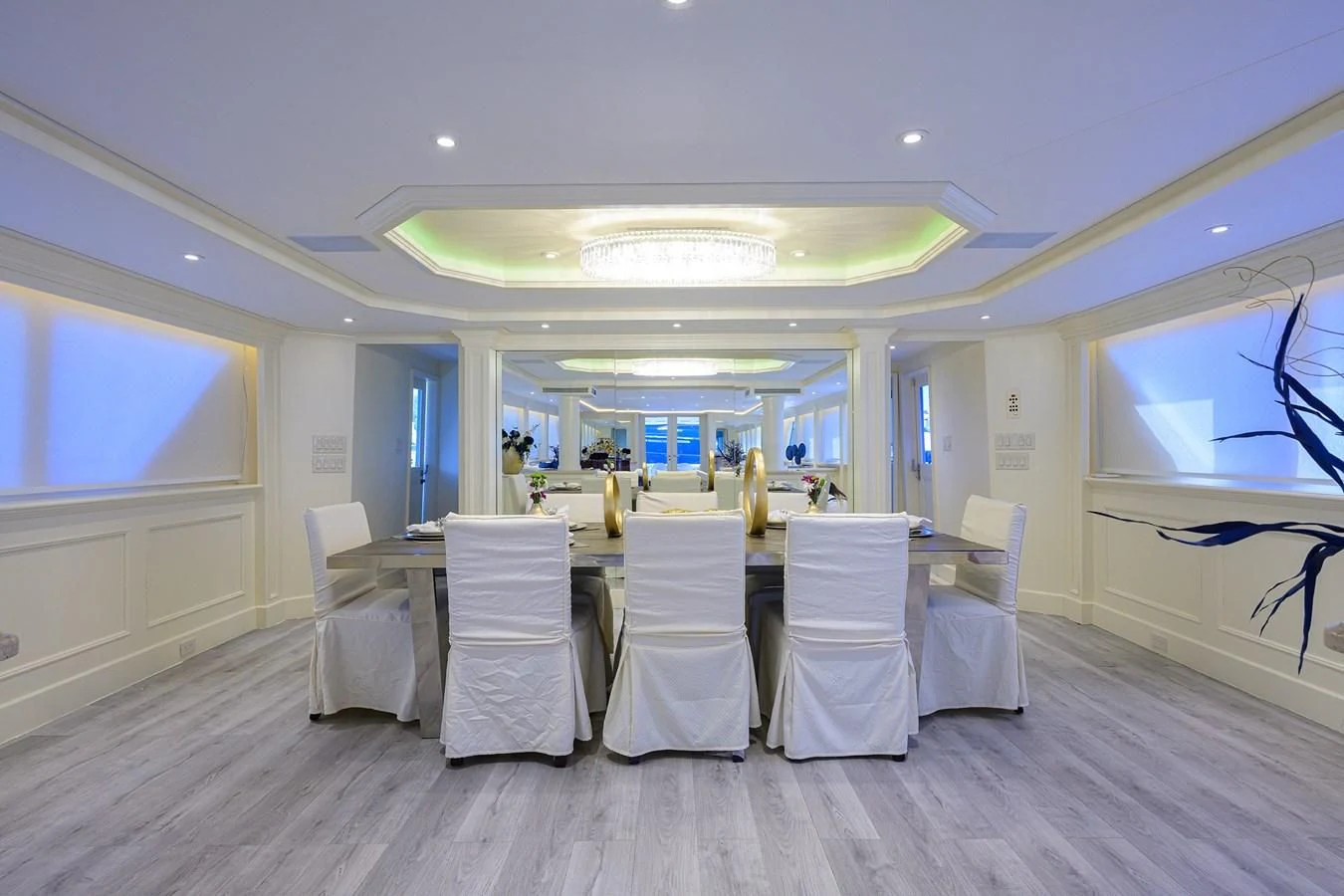a room with a table and chairs aboard OCEAN DRIVE Yacht for Sale