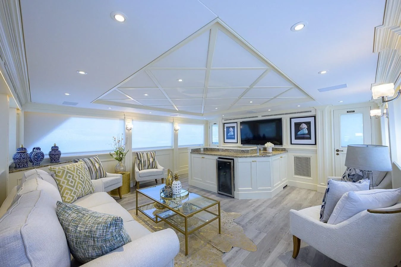 a living room with a fireplace aboard OCEAN DRIVE Yacht for Sale