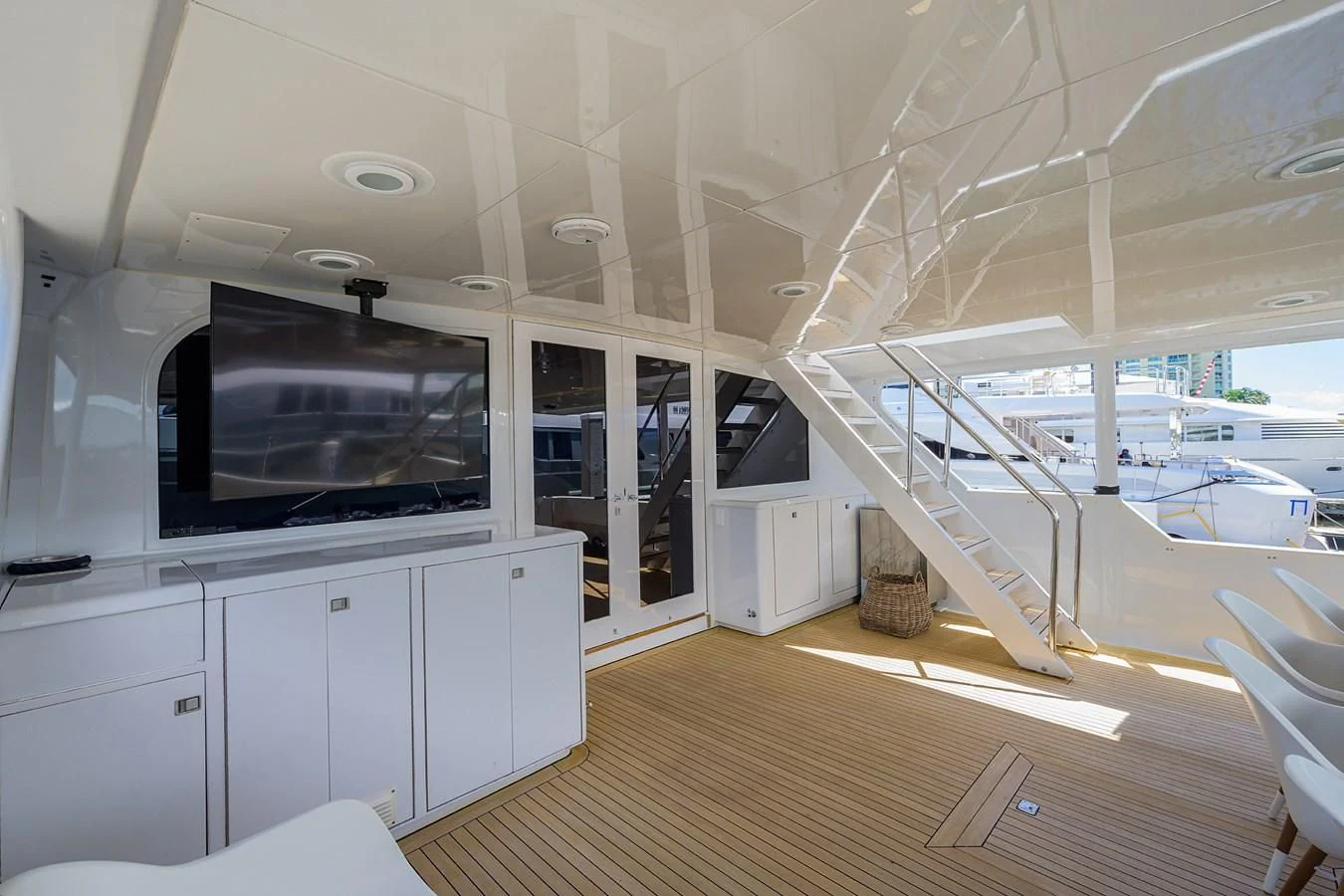 a room with a large television and a large window aboard OCEAN DRIVE Yacht for Sale