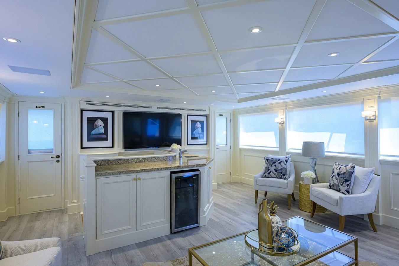 a living room with a fireplace aboard OCEAN DRIVE Yacht for Sale