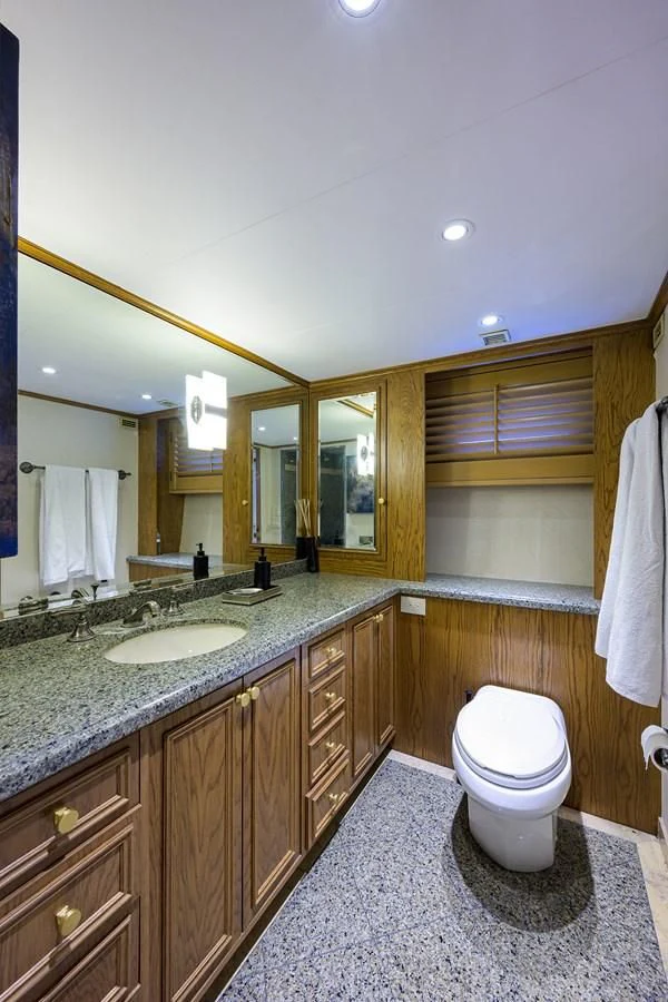a bathroom with a toilet and a sink aboard OCEAN DRIVE Yacht for Sale