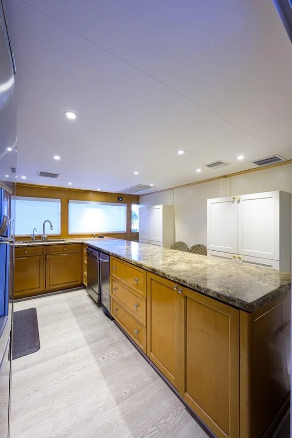 a kitchen with a large island aboard OCEAN DRIVE Yacht for Sale