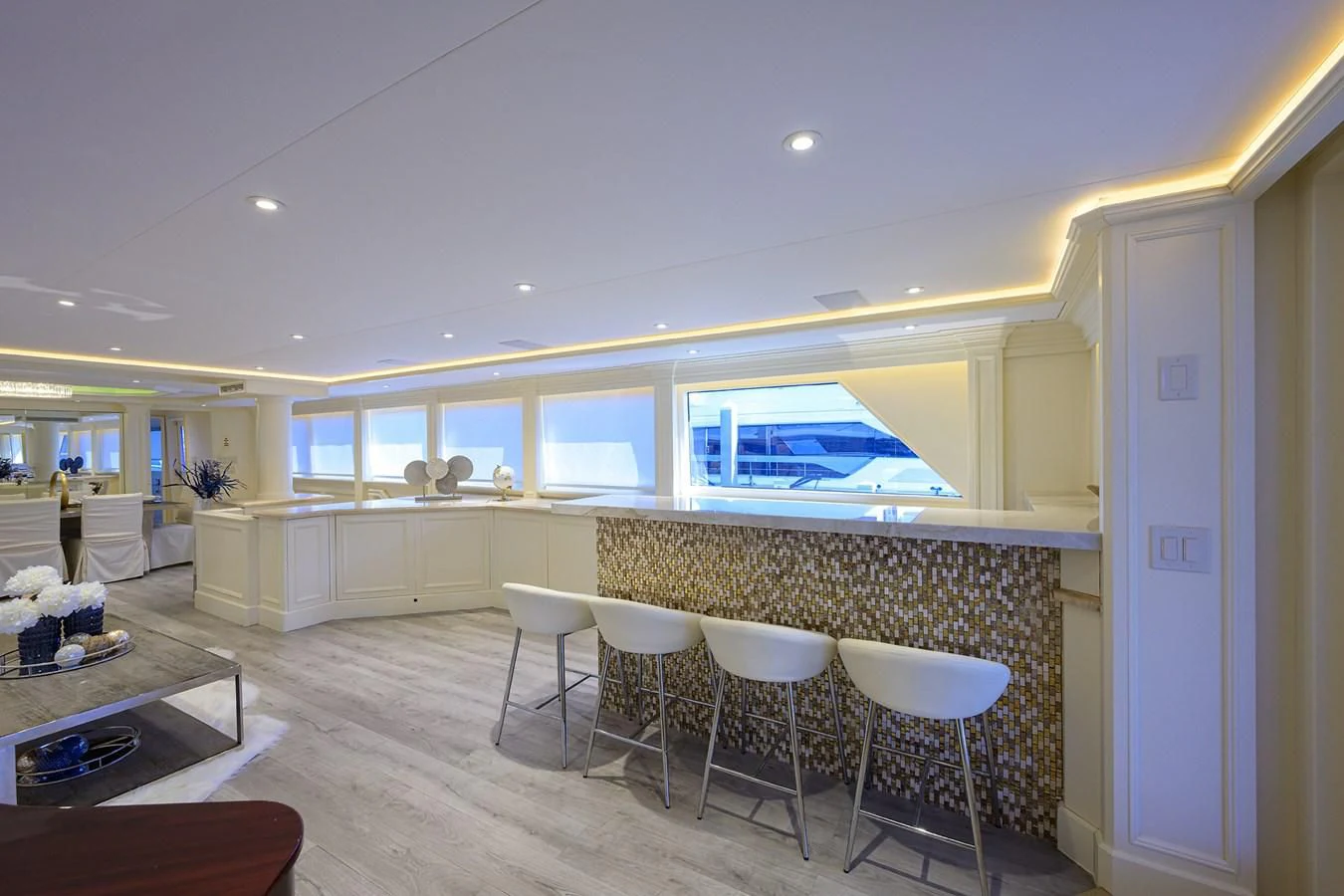 a room with tables and chairs aboard OCEAN DRIVE Yacht for Sale