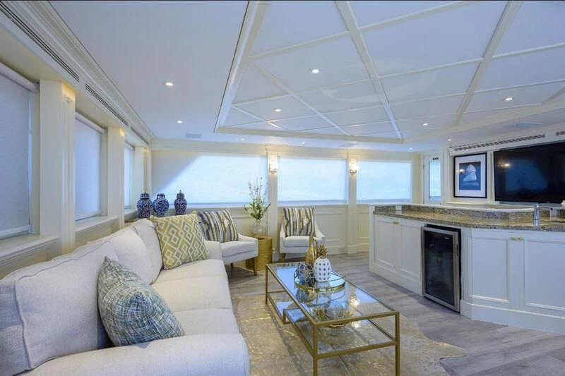 a living room with a fireplace aboard OCEAN DRIVE Yacht for Sale