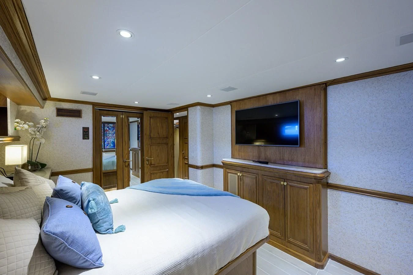 a bedroom with a bed and a television aboard OCEAN DRIVE Yacht for Sale