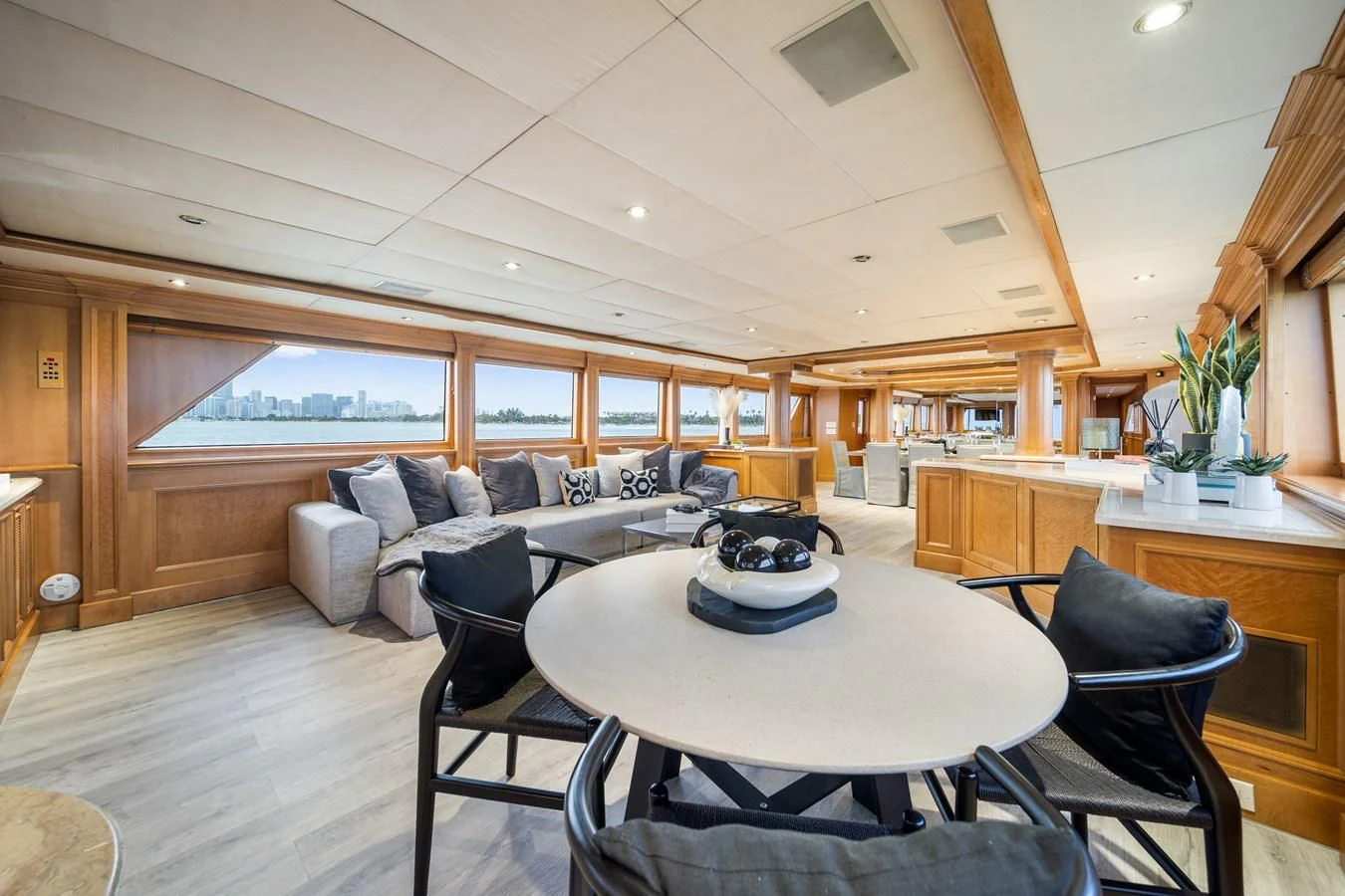 a living room with a table and chairs aboard OCEAN DRIVE Yacht for Sale