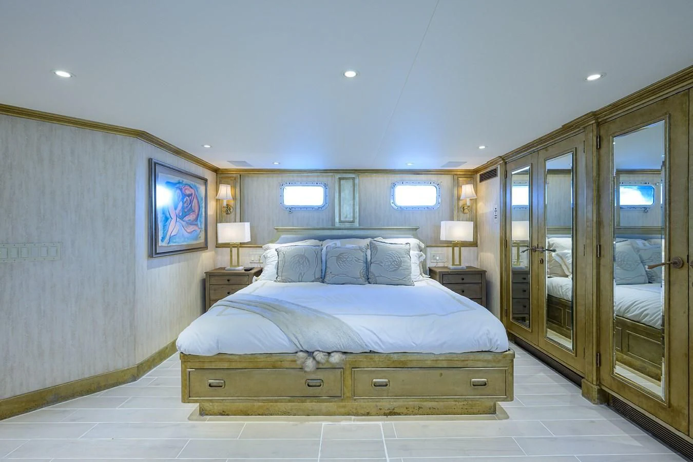 a bedroom with a bed and a mirror aboard OCEAN DRIVE Yacht for Sale