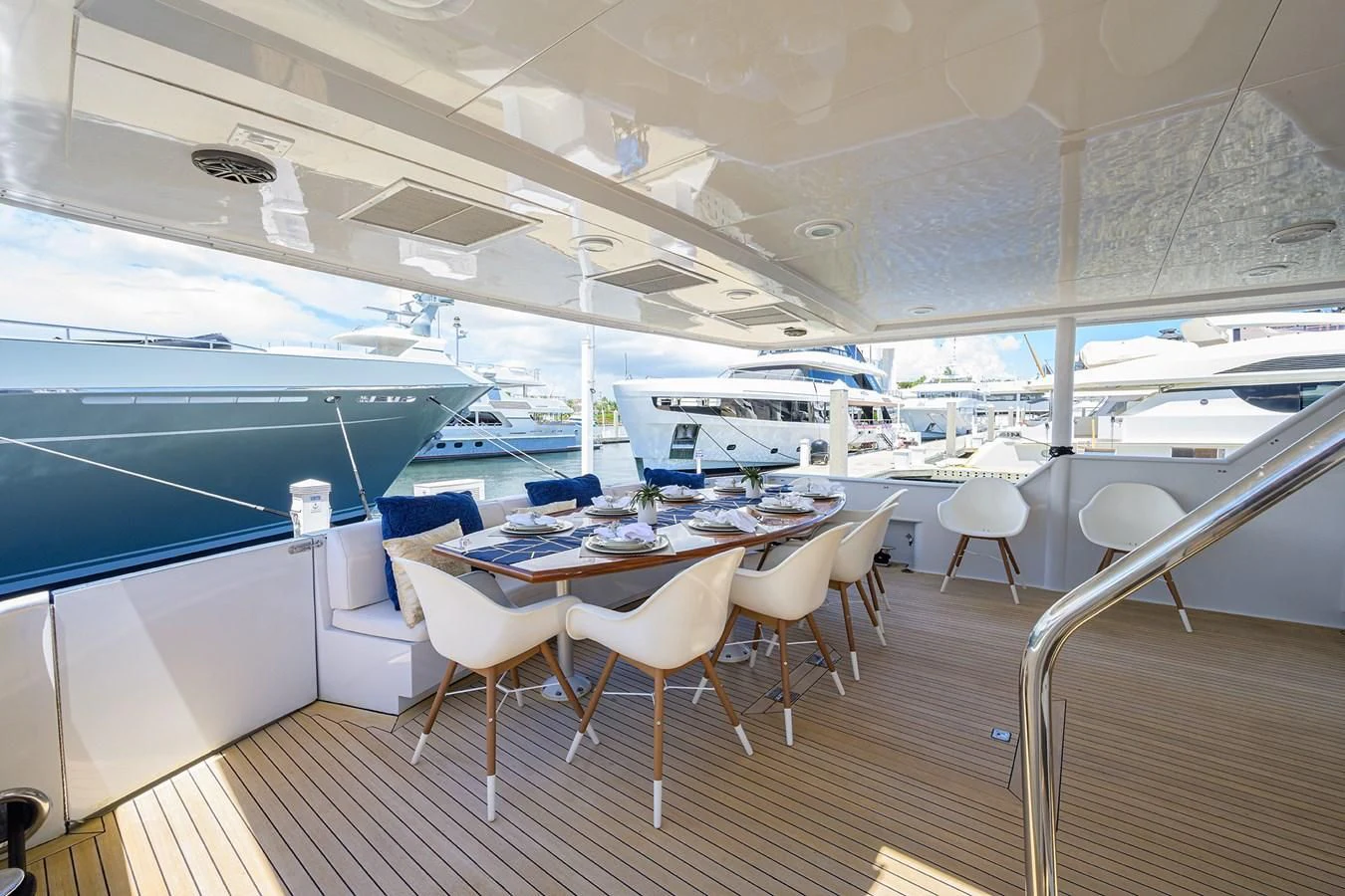 a room with tables and chairs aboard OCEAN DRIVE Yacht for Sale