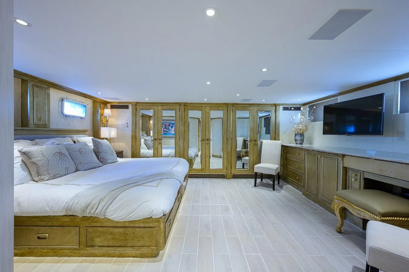 a bedroom with a bed and a tv aboard OCEAN DRIVE Yacht for Sale