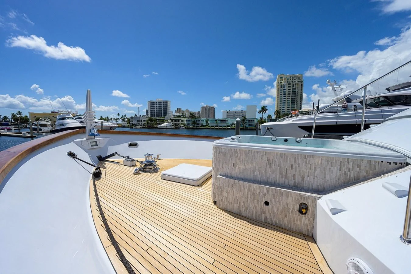 a deck with a view of a city and water aboard OCEAN DRIVE Yacht for Sale