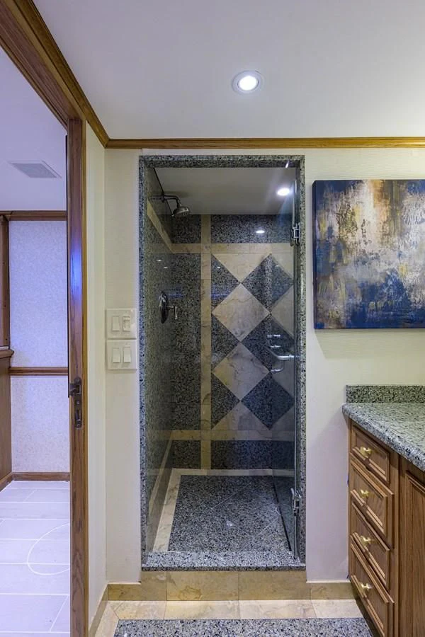 a bathroom with a glass shower aboard OCEAN DRIVE Yacht for Sale
