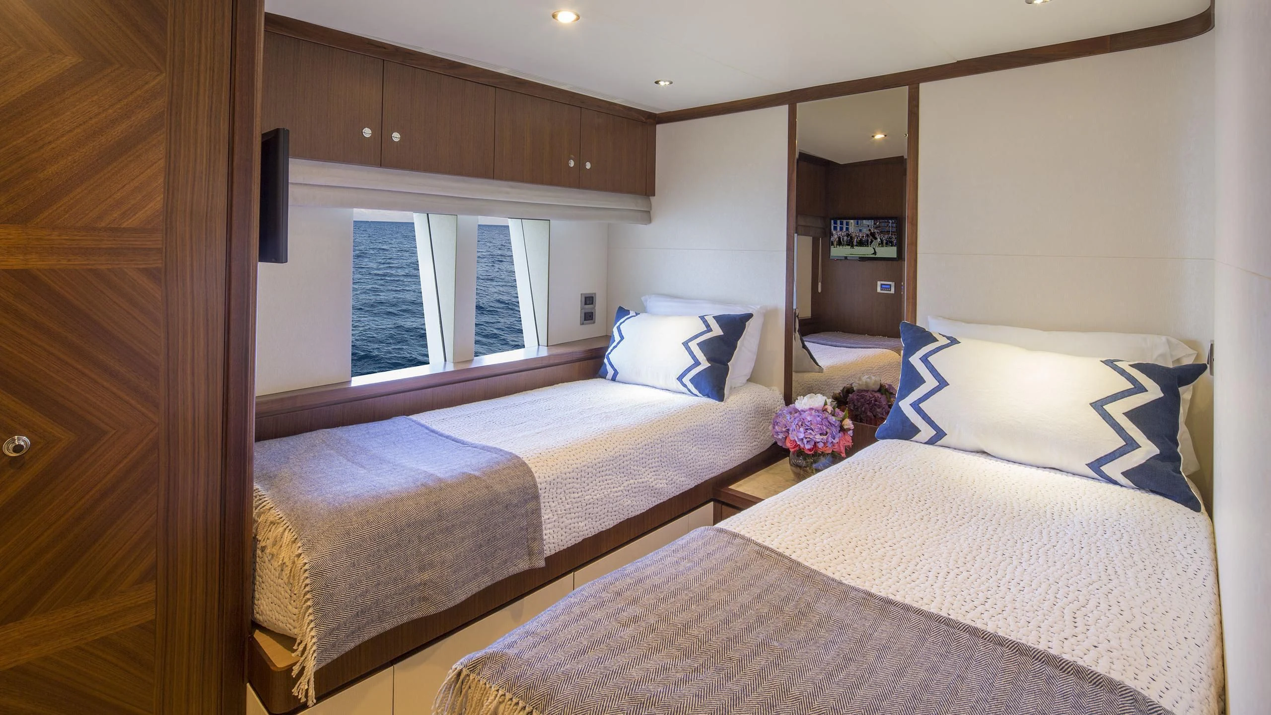 a room with two beds aboard TOSCA Yacht for Sale