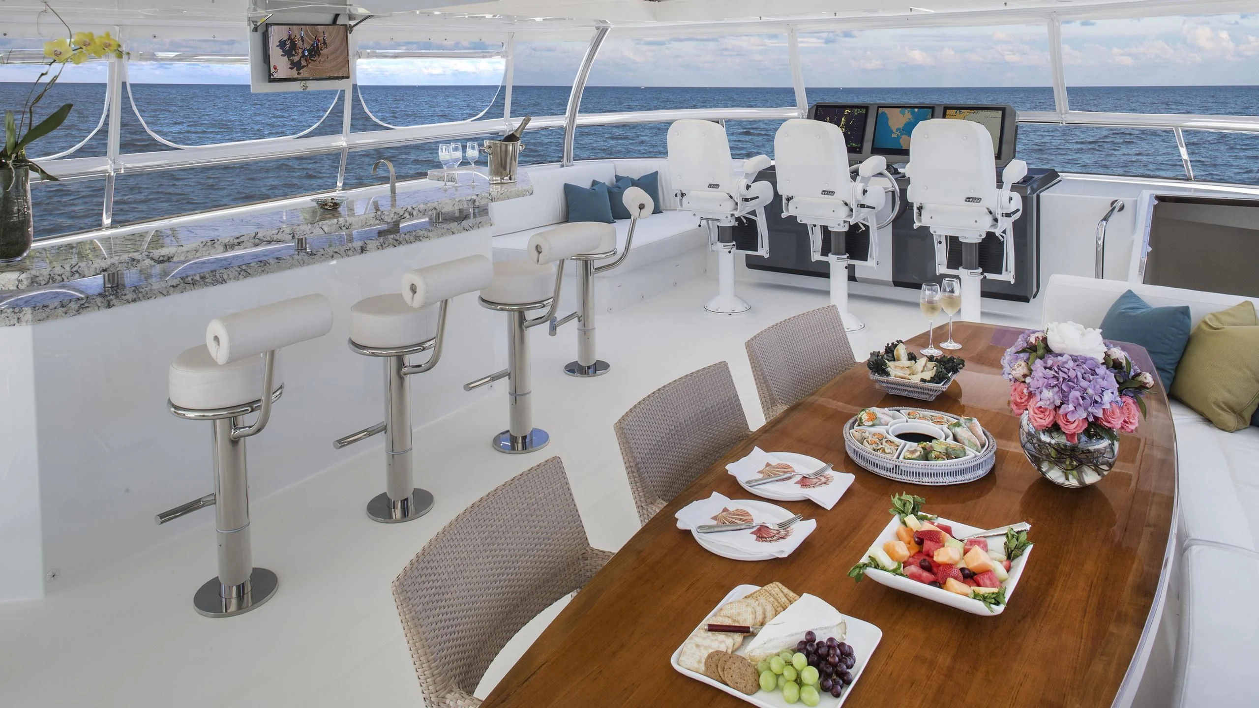 a dining room with a table and chairs aboard TOSCA Yacht for Sale