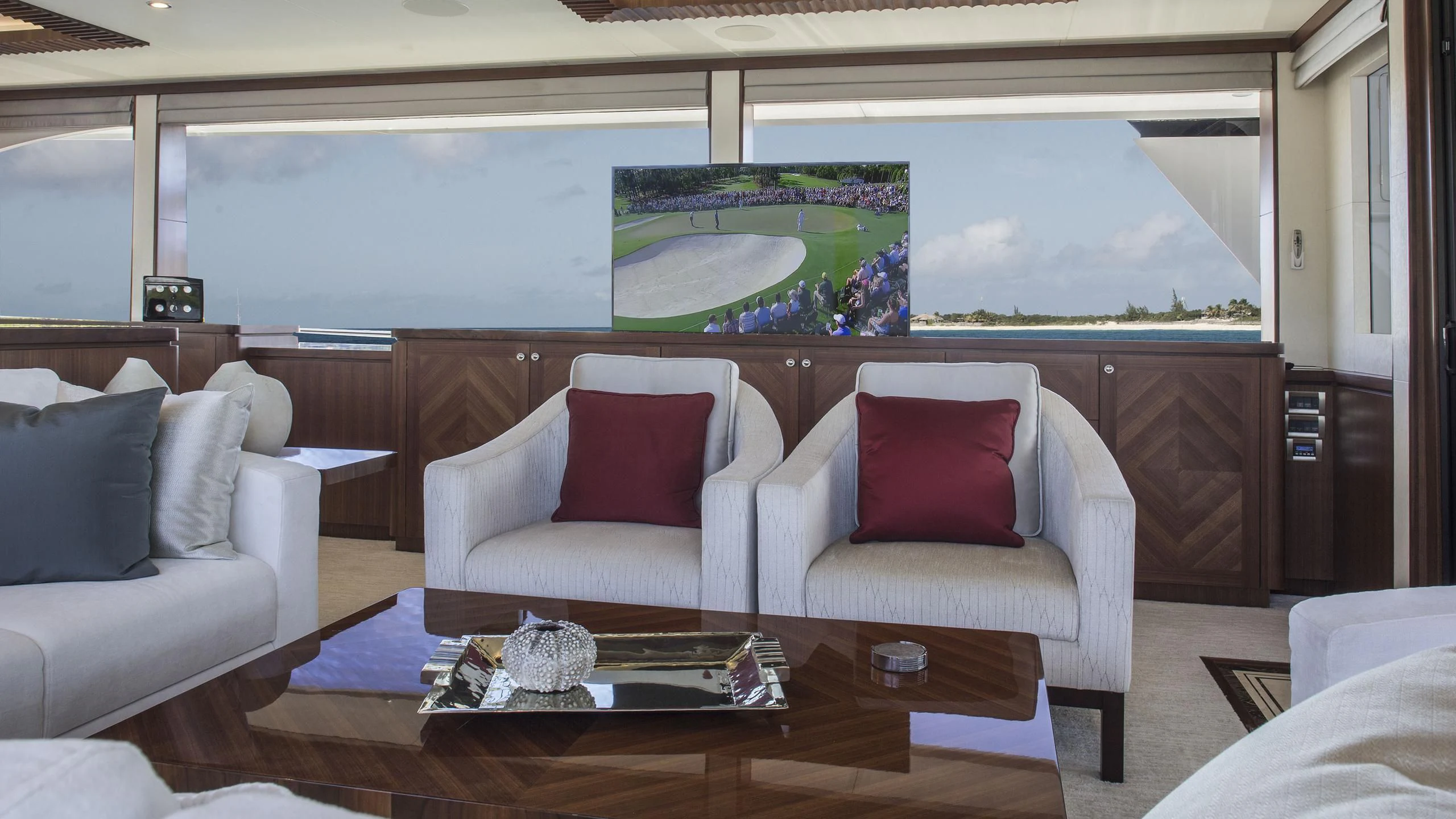 a living room with a large screen aboard TOSCA Yacht for Sale