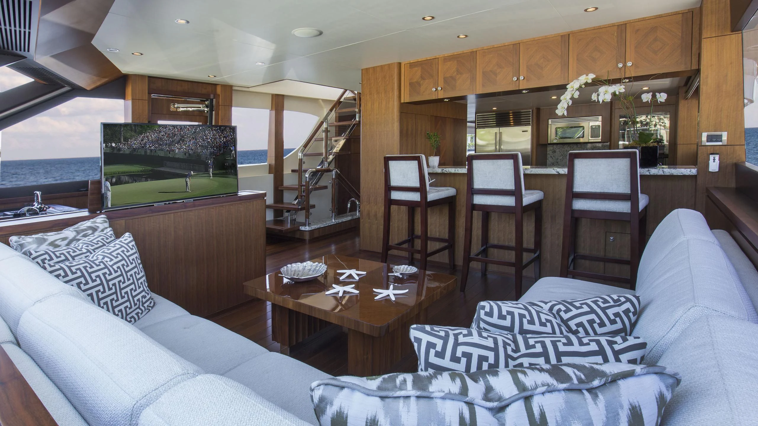 a living room with a couch and a table aboard TOSCA Yacht for Sale