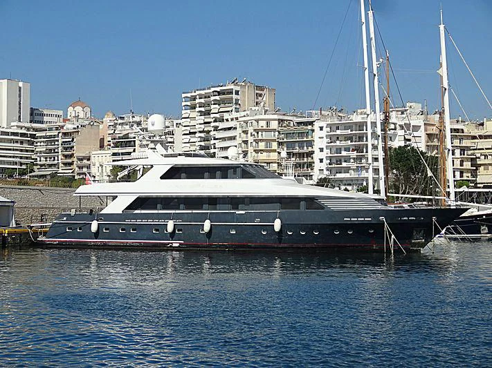 a large white boat in a harbor aboard WOLFOZ Yacht for Sale