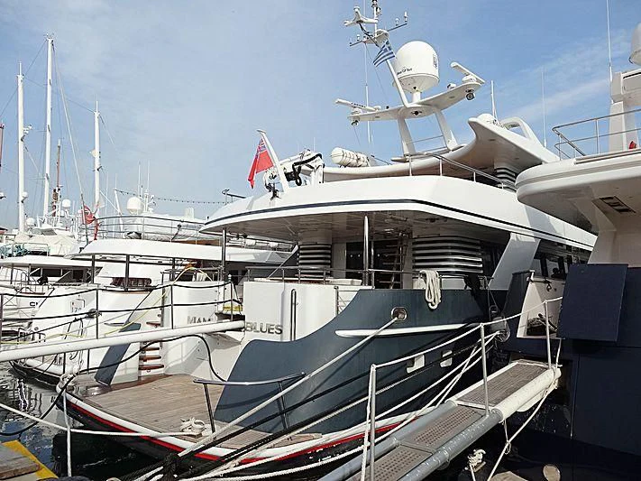 a boat docked at a pier aboard WOLFOZ Yacht for Sale