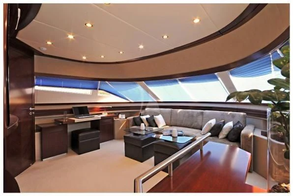 a living room with a large glass window aboard LADY CAROLA Yacht for Sale