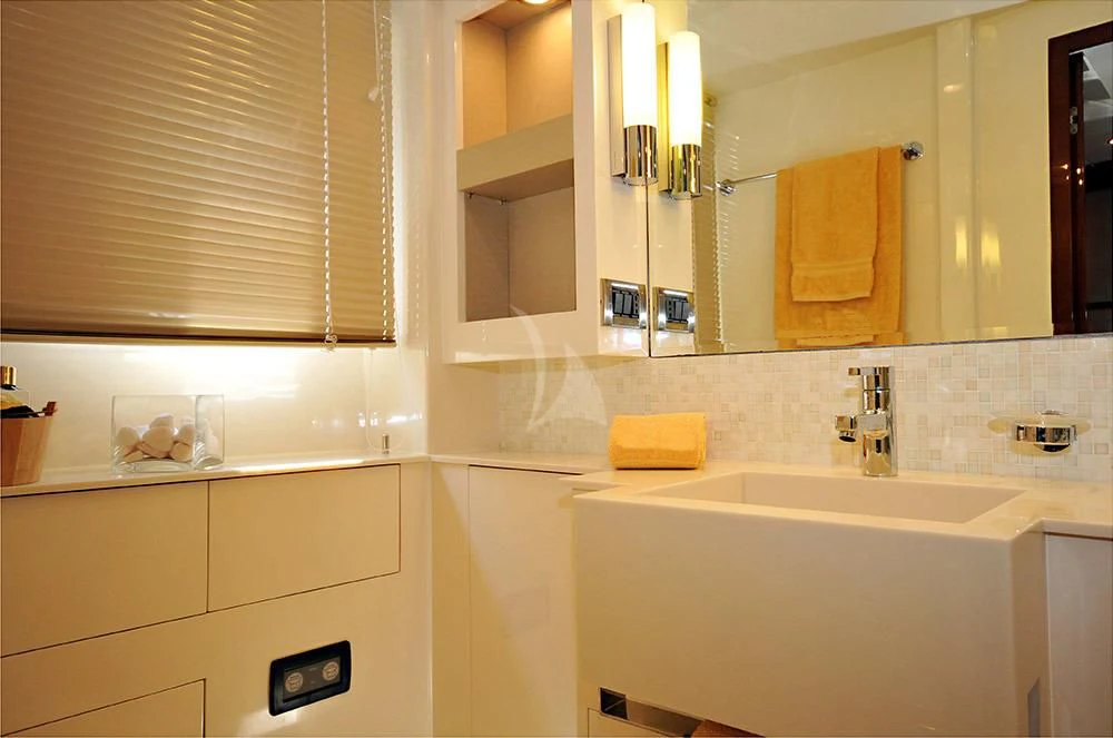 a bathroom with a sink and cabinets aboard LADY CAROLA Yacht for Sale