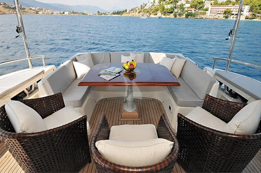 a table and chairs on a boat aboard LADY CAROLA Yacht for Sale