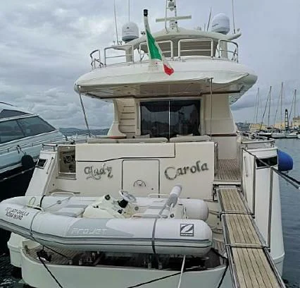 a boat docked at a pier aboard LADY CAROLA Yacht for Sale