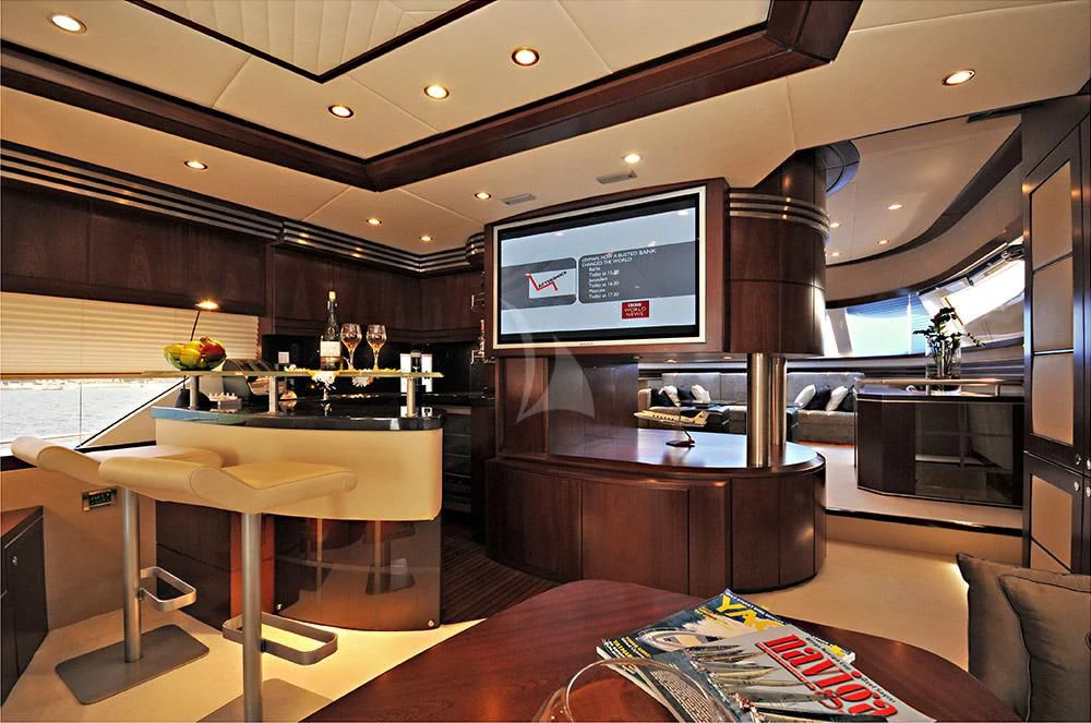 a living room with a large tv aboard LADY CAROLA Yacht for Sale