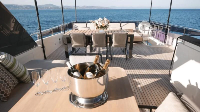 a pot of food on a table aboard NINETEEN Yacht for Sale