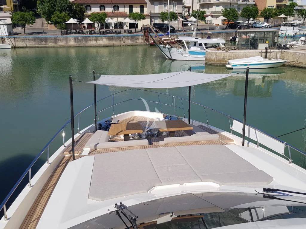 a swimming pool with boats aboard NINETEEN Yacht for Sale