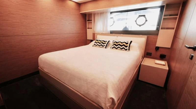 a bed in a room aboard NINETEEN Yacht for Sale