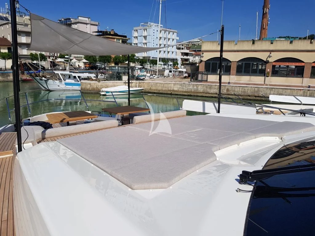 a large building with a large white building in the background aboard NINETEEN Yacht for Sale