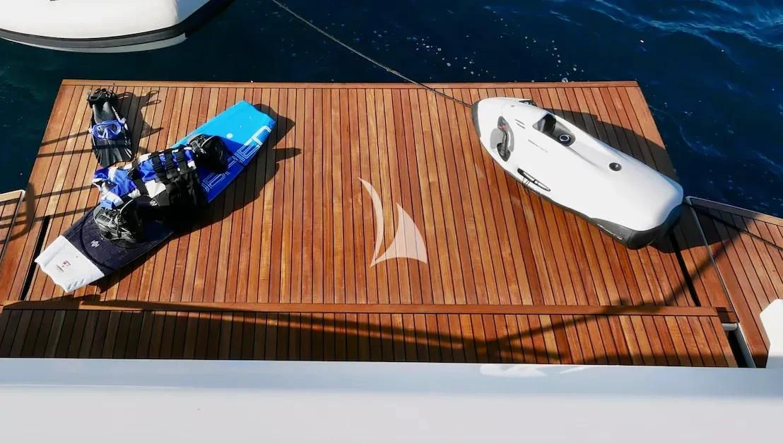 a video game controller and a video game controller on a wooden surface aboard NINETEEN Yacht for Sale