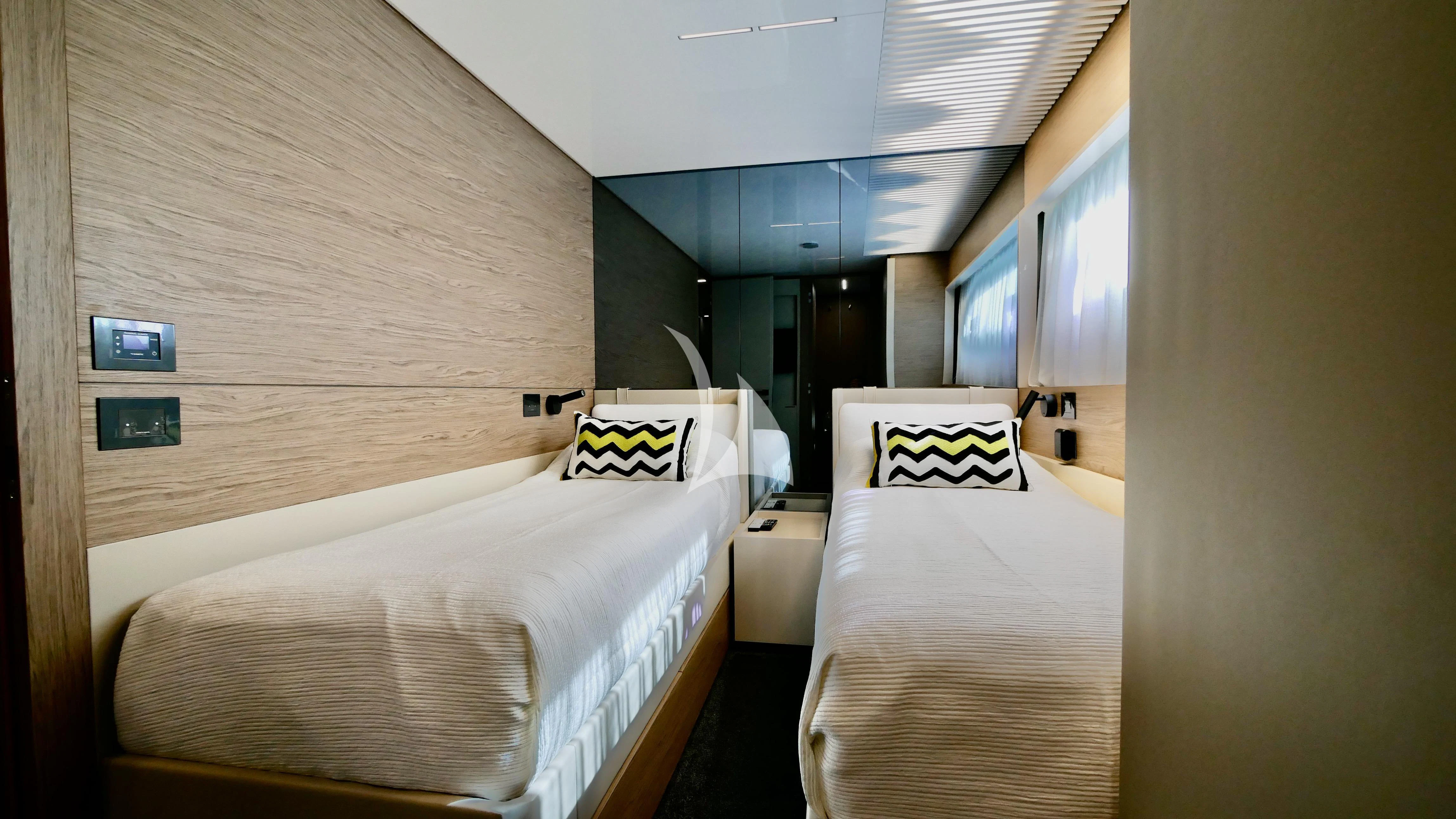 a room with two beds aboard NINETEEN Yacht for Sale