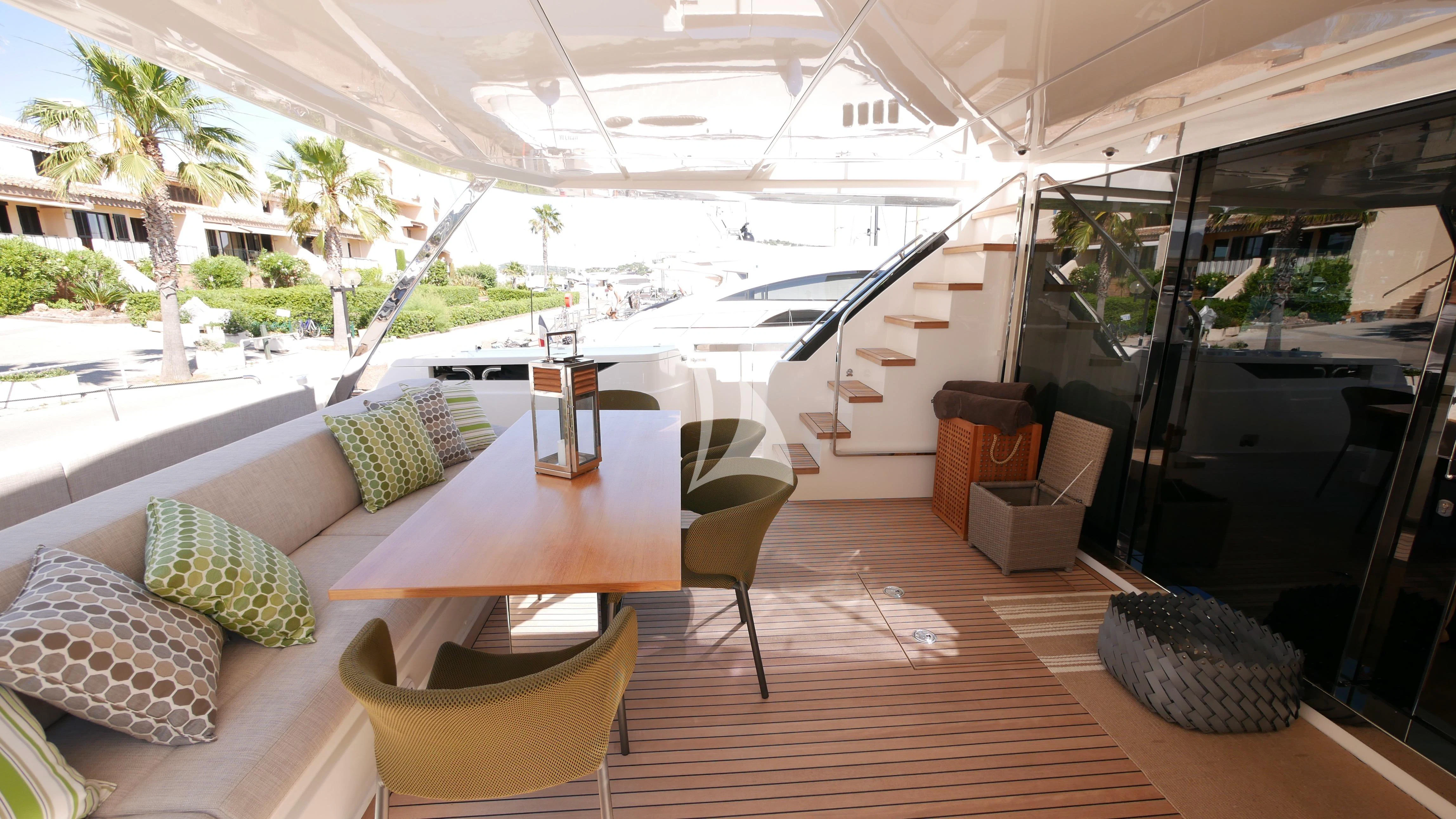 a living room with a large open staircase aboard NINETEEN Yacht for Sale